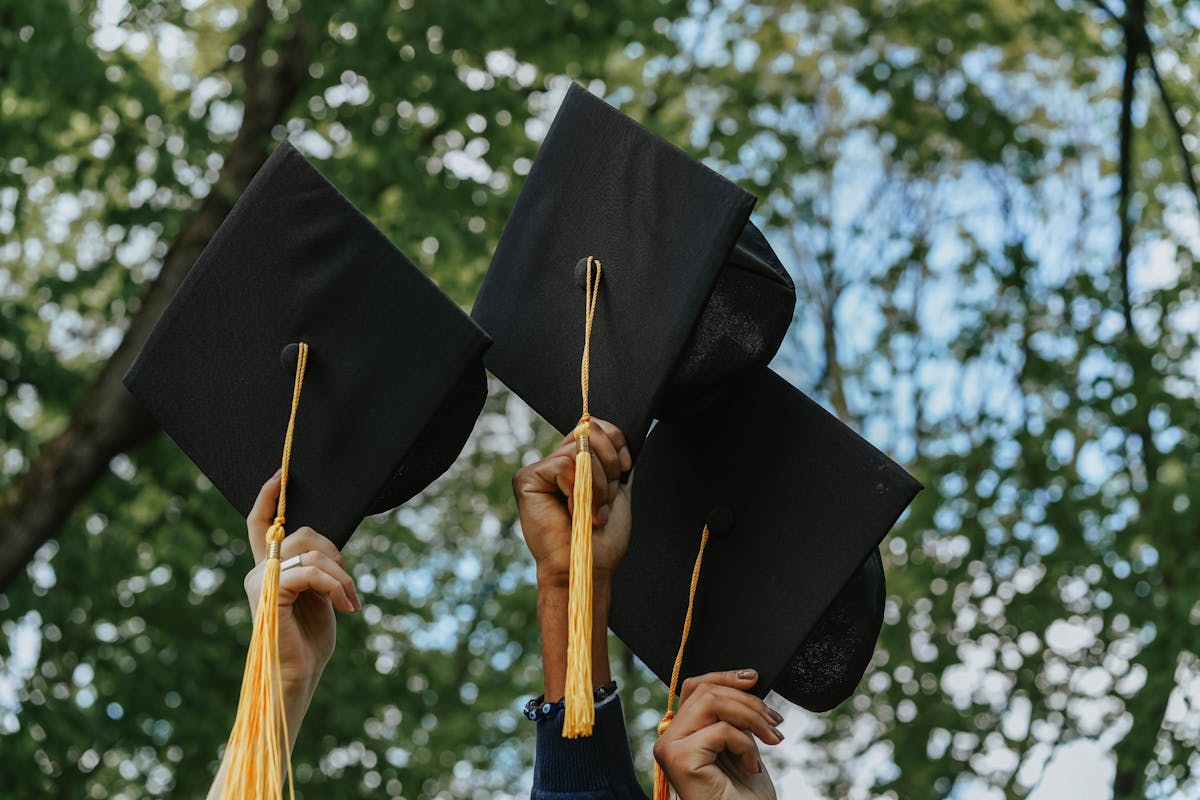 Graduation caps representing tax-free 529 plan education withdrawals