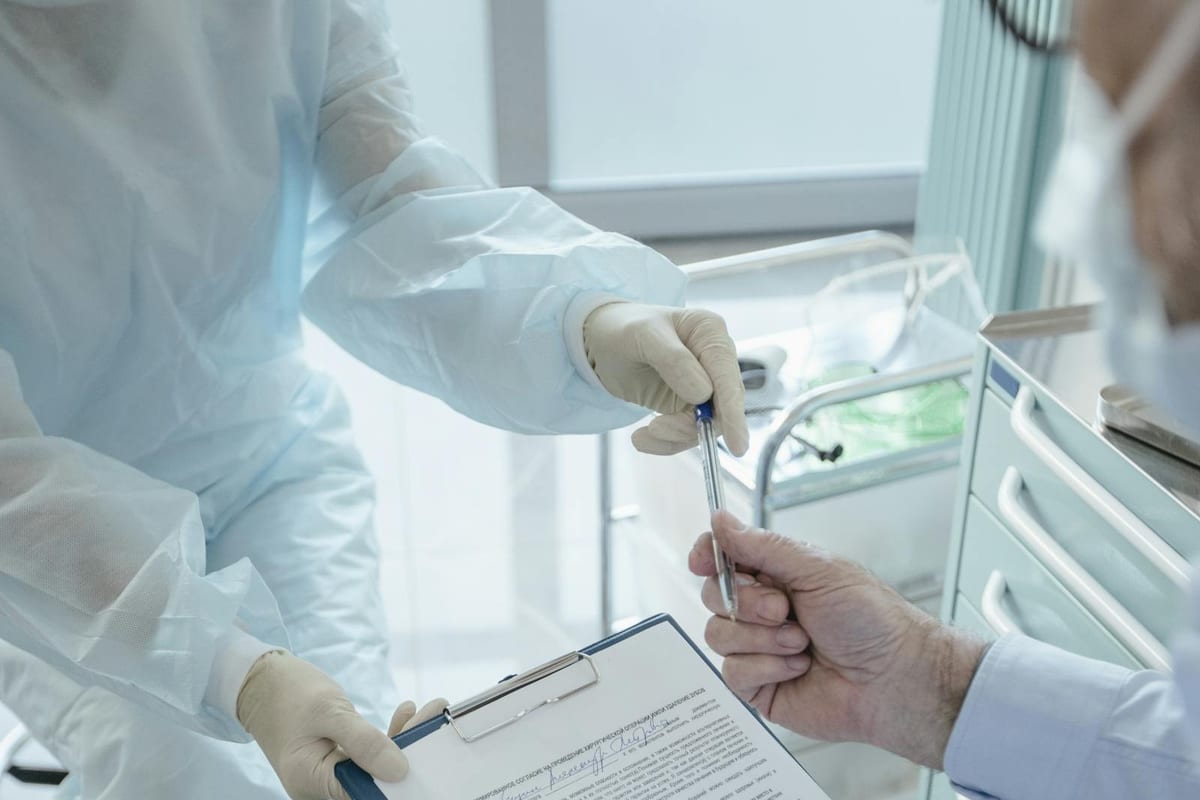 Doctor reviewing medical paperwork for HSA contribution limits 2026 planning