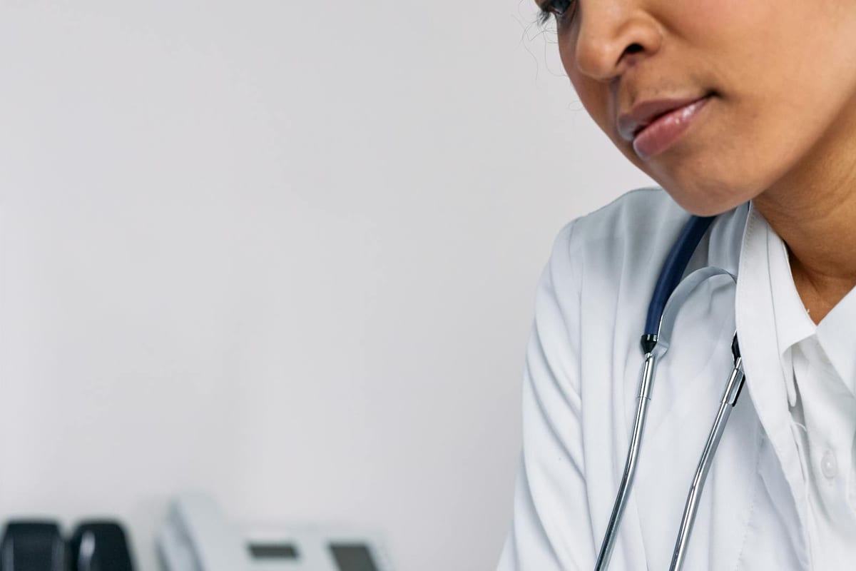 Doctor completing medical paperwork for HSA eligibility rules
