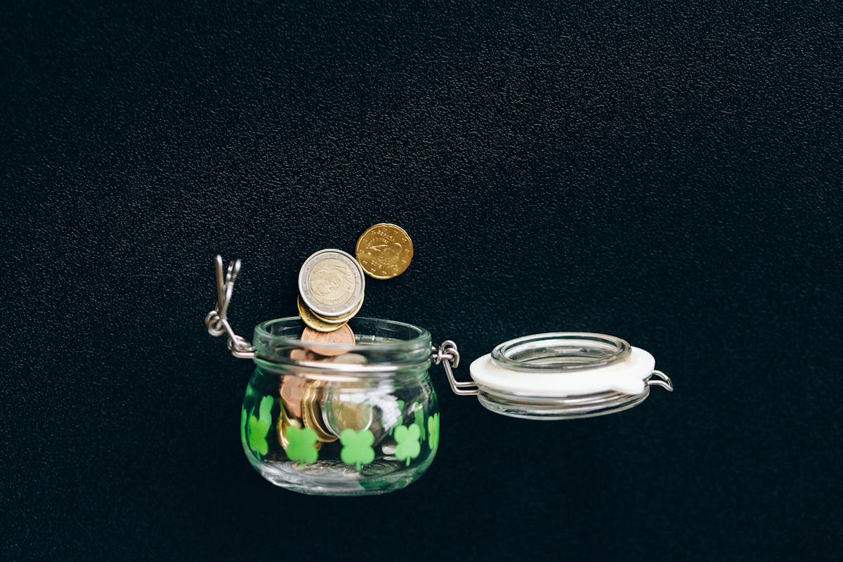 Sinking fund categories mapped as labeled savings jars on a planning desk
